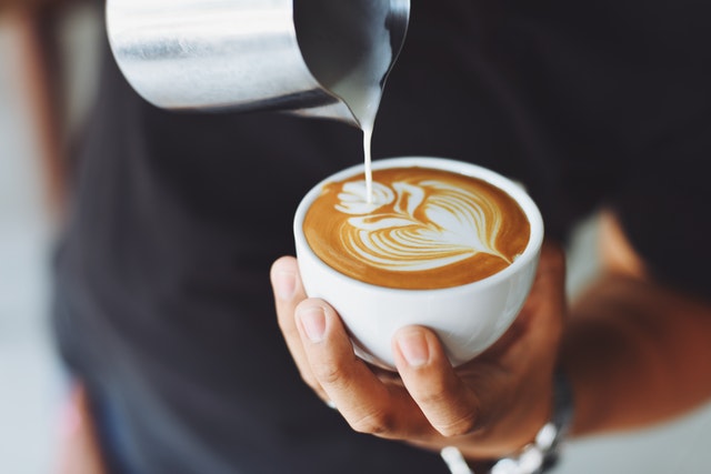 Fresh cappuccino being prepared during a Wine and Dine tour